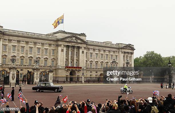 Catherine Middleton makes her way past Buckingham Palace in a car with her father Michael Middleton to attend the Royal Wedding of Prince William to...