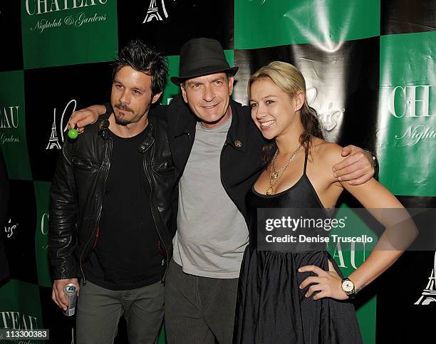 Rob Patterson, Charlie Sheen and Natalie Kenly arrive at Chateau Nightclub & Gardens on April 30, 2011 in Las Vegas, Nevada.