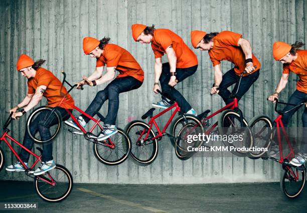 multiple exposure of man doing bmx trick - meervoudig beeld stockfoto's en -beelden