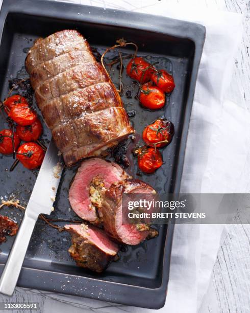 tray of braciole with tomatoes - ローストビーフ ストックフォトと画像