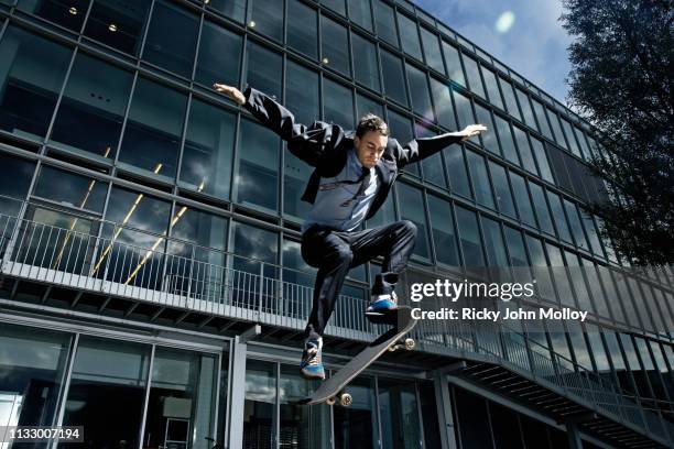 skateboarder showing off his skills - stunt stock pictures, royalty-free photos & images