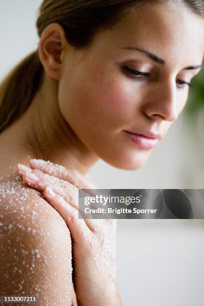 young woman with salt-peeling-mask - body scrub stock pictures, royalty-free photos & images