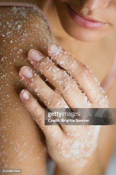 young woman with salt-peeling-mask - body scrub bildbanksfoton och bilder