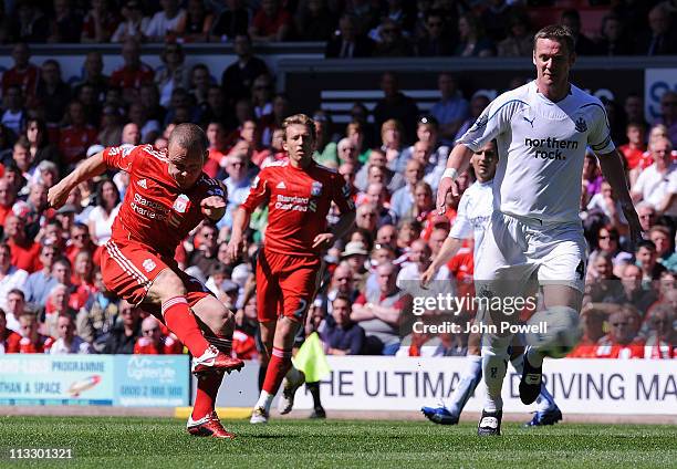 Jay Spearing of Liverpool tries a shot past Keivn Nolan of Newcastle during the Barclays Premier League match between Liverpool and Newcastle United...