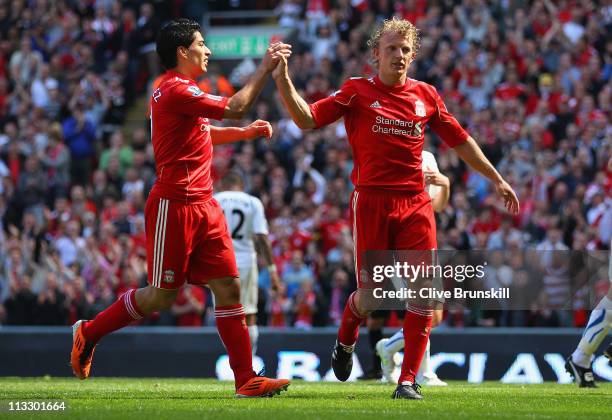 Dirk Kuyt of Liverpool celebrates with team mate Luis Suarez after scoring the second goal from the penalty spot during the Barclays Premier League...