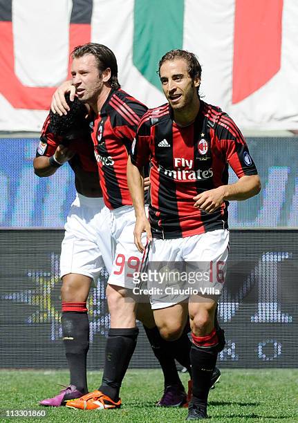 Mathieu Flamini of AC Milan celebrates with team-mates after scoring the opening goal of the Serie A match between AC Milan and Bologna FC at Stadio...