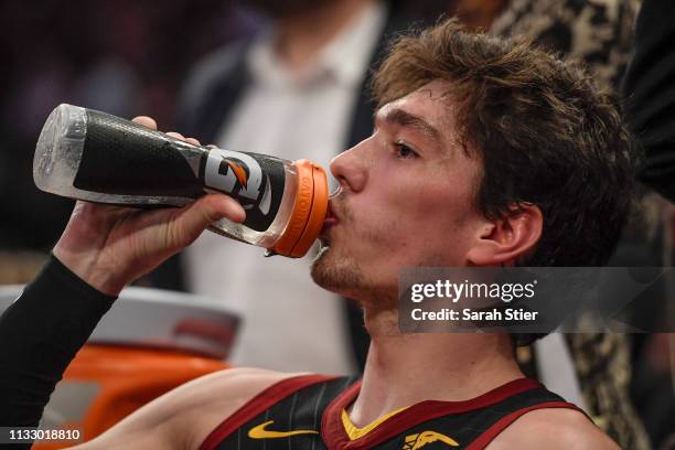 Cedi Osman of the Cleveland Cavaliers drinks from a Gatorade bottle during the second half of the game against the New York Knicks at Madison Square...