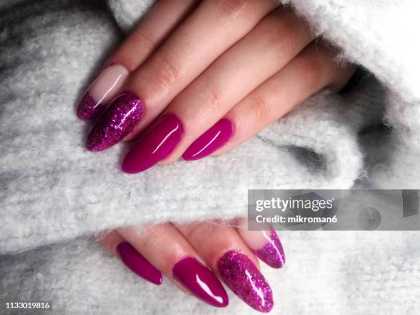 close-up of woman fingers with nail art manicure in pink colour - painting toenails stock-fotos und bilder