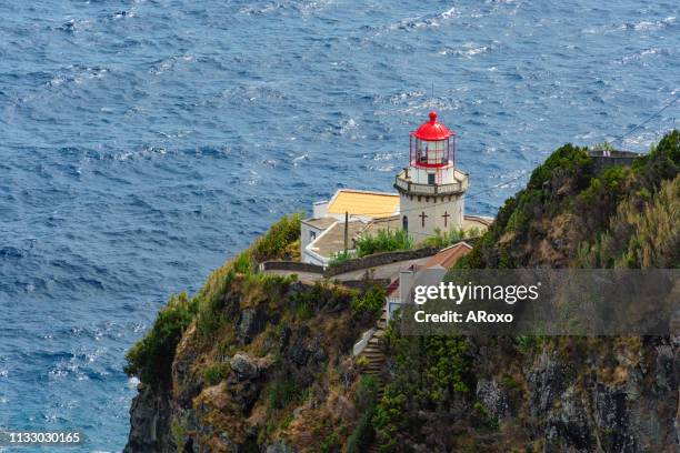 ponta do arnel lighthouse on the northeast coast of the island of são miguel in the azores. - leuchtturm schiff stock-fotos und bilder