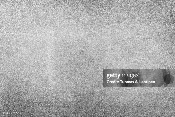 natural granite stone abstract texture background with vignetting in black and white. - granito fotografías e imágenes de stock