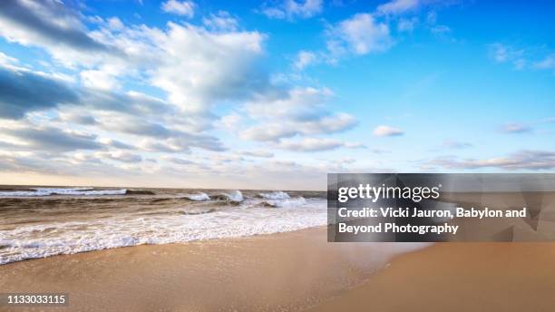 clouds, seascape, and blue sky at morning on jones beach - jones beach stock-fotos und bilder