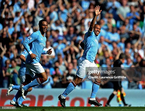 Nigel de Jong of Manchester City celebrates scoring the opening goal during the Barclays Premier League match between Manchester City and West Ham...