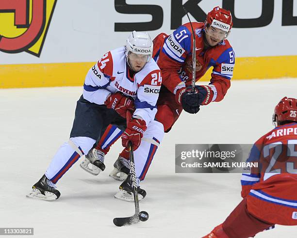 Slovenia's Rok Ticar vies with Russia's Fyodor Tyutin during their IIHF Ice Hockey World Championship group A match in Bratislava on May 1, 2011. AFP...