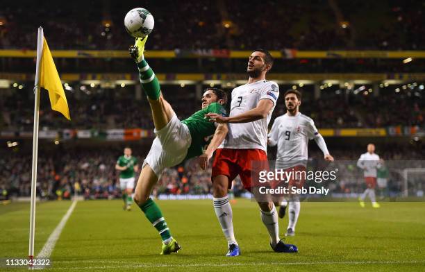 Dublin , Ireland - 26 March 2019; Robbie Brady of Republic of Ireland in action against Davit Khocholava of Georgia during the UEFA EURO2020 Group D...