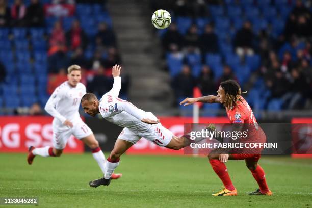 Denmark's forward Martin Braithwaite and Switzerland's defender Kevin Mbabu vie for the ball during the UEFA Euro 2020 Group D qualification football...