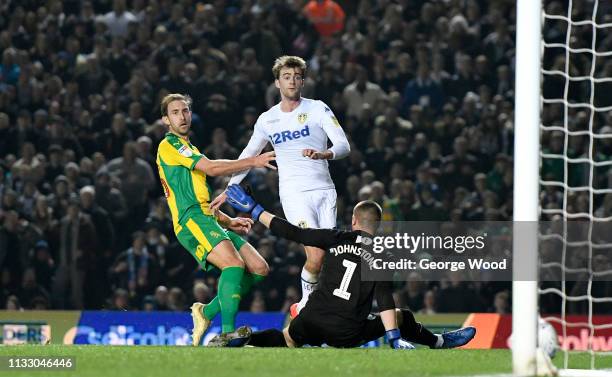 Patrick Bamford of Leeds United holds off challenge by Craig Dawson of West Bromwich Albion to score his sides second goal past goalkeeper Sam...