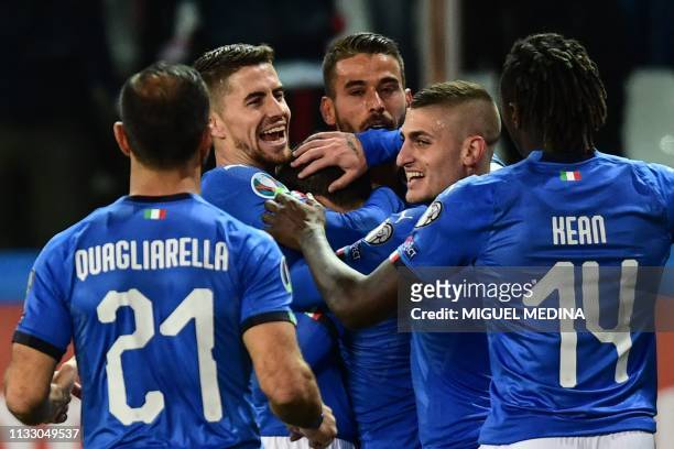 Italy's midfielder Marco Verratti congratulates Italy's midfielder Stefano Sensi after he opened the scoring during the Euro 2020 Group J qualifying...
