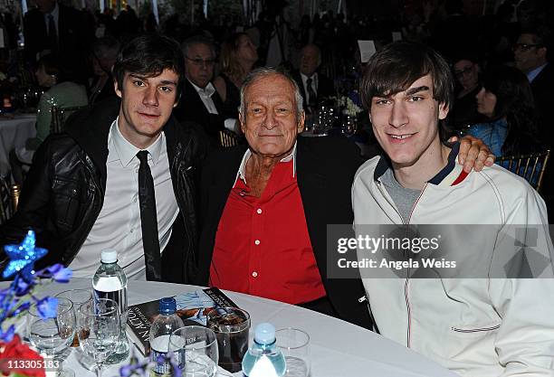Playboy founder Hugh Hefner poses with his sons Cooper and Marston Hefner at the Thalians 55th Annual Gala at the Playboy Mansion on April 30, 2011...