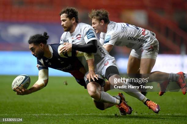 Chris Vui of Bristol Bears is tackled by Danny Cipriani of Gloucester during the Gallagher Premiership Rugby match between Bristol Bears and...