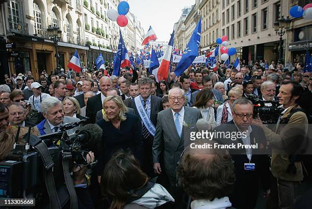 France's far-right National Front President, Marine Le Pen and her father Jean-Marie Le Pen takes part in a march as part of the party's annual...