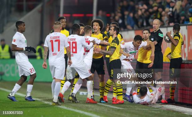 The players of Dortmund and of Augsburg have a dispute during the Bundesliga match between FC Augsburg and Borussia Dortmund at WWK-Arena on March...