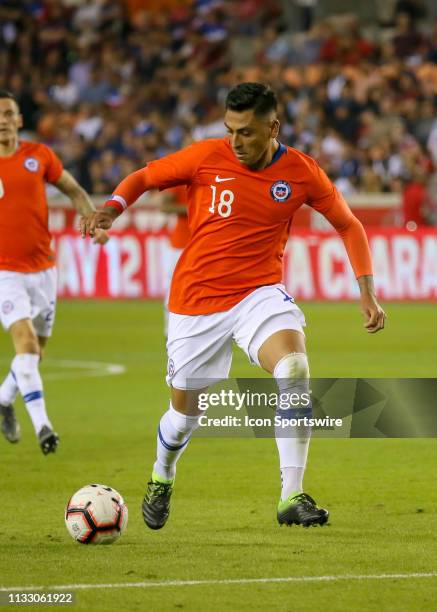 Chile defender Gonzalo Jara dribbles the ball down the pitch during the International Friendly soccer match between the USA and Chile on March 26,...