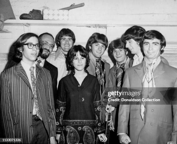 Box Tops members guitarist Gary Talley, drummer Thomas Boggs, bassist Rick Allen, and singer Alex Chilton pose for a portrait with attendees at the...