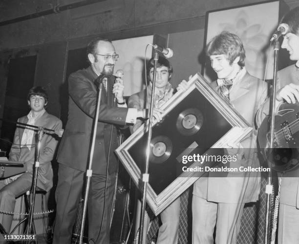 Bell Records President Larry Uttal presents Alex Chilton Box Tops members performs onstage at the Arthur Club at a press party hosted by Bell Records...