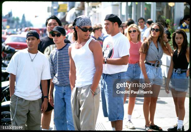 No cell phones can be seen as young people meet and talk as they walk on Melrose Avenue August 8, 1993 West Hollywood , Los Angeles, California