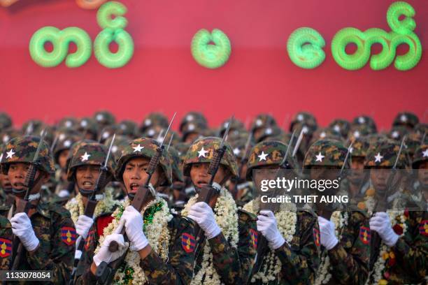Myanmar's soldiers march in a formation during a parade to mark the country's 74th Armed Forces Day in Naypyidaw on March 27, 2019.