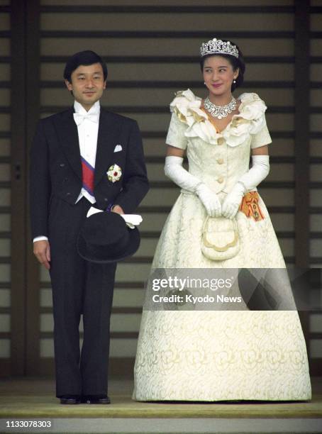 Photo taken June 9 shows Japanese Crown Prince Naruhito and Crown Princess Masako on their wedding day after an audience with the emperor and empress...