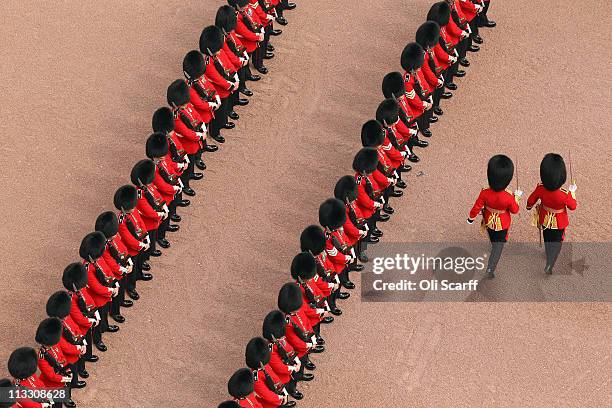Soldiers form up in front of Buckingham Palace before Prince William, Duke of Cambridge and Catherine, Duchess of Cambridge greet crowds from the...