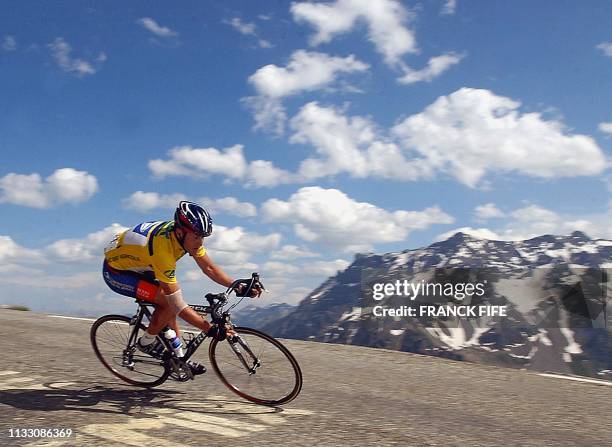 Lance Armstrong rides down the Galibier mountain, 14 June 2003, during the sixth stage of the Dauphine Libere race between Challes-les-Eaux and...