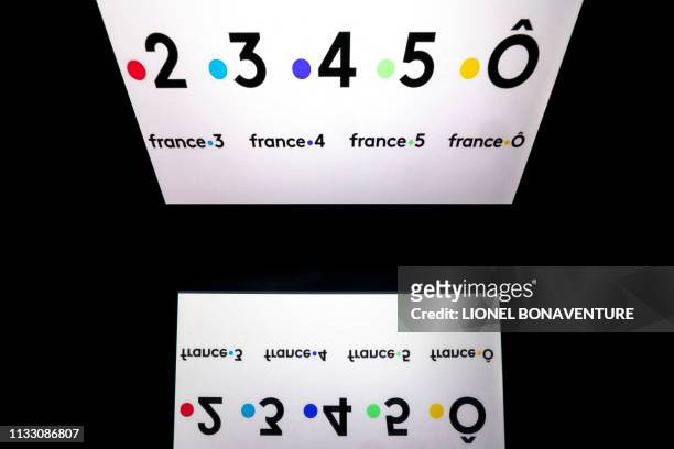 This illustration picture taken on March 26, 2019 shows the 5 logos of the French public television channels, "France 2", "France 3", "France 4", "...