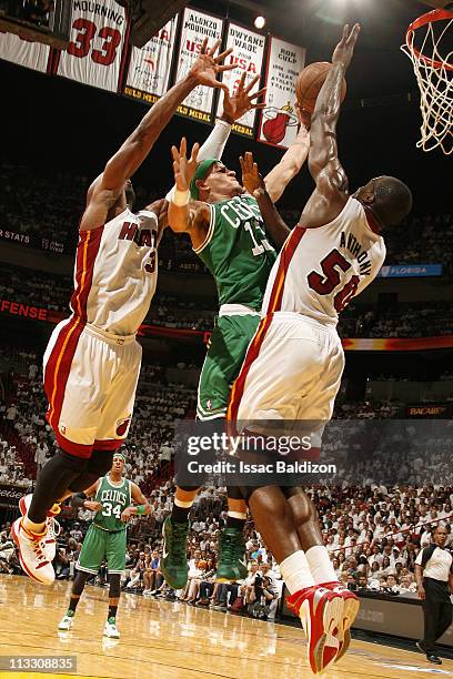 Delonte West of the Boston Celtics shoots against Joel Anthony and Dwyane Wade of the Miami Heat in Game One of the Eastern Conference Semifinals in...