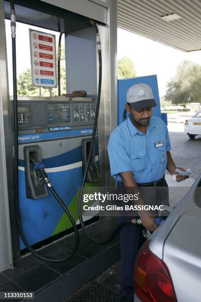 Economic Illustration In The Sultanate Of Oman - On November 20Th, 2005 - In Mascate , Oman - Here, A Petrol Pump Attendant In An 'Oman Oil ' Gas...