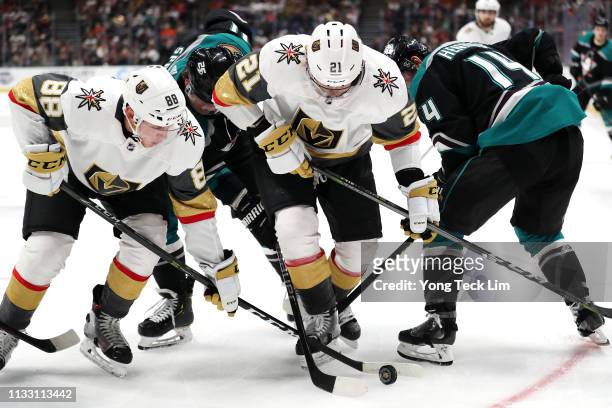 Cody Eakin and Nate Schmidt of the Vegas Golden Knights compete for the puck against Daniel Sprong and Adam Henrique of the Anaheim Ducks during the...