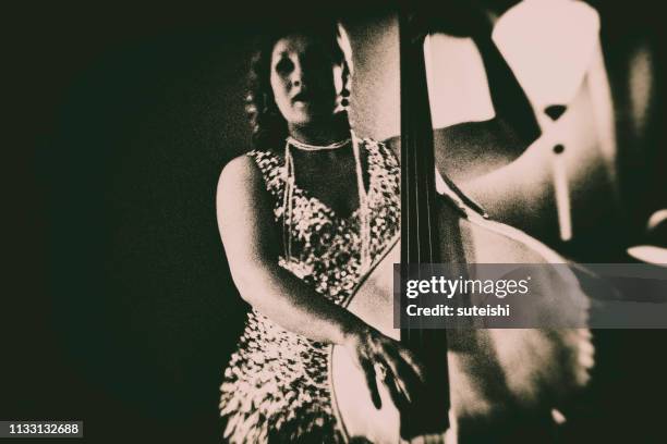 the double bass player in the nightclub - speakeasy stock pictures, royalty-free photos & images