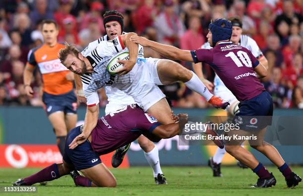 Braydon Ennor of the Crusaders takes on the defence during the round three Super Rugby match between the Reds and the Crusaders at Suncorp Stadium on...