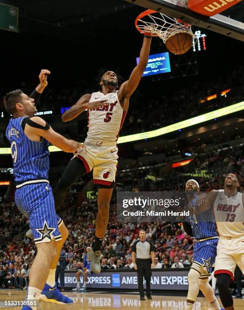 Miami Heat forward Derrick Jones Jr. Dunks against Orlando Magic center Nikola Vucevic in the second quarter of an NBA basketball game at the...