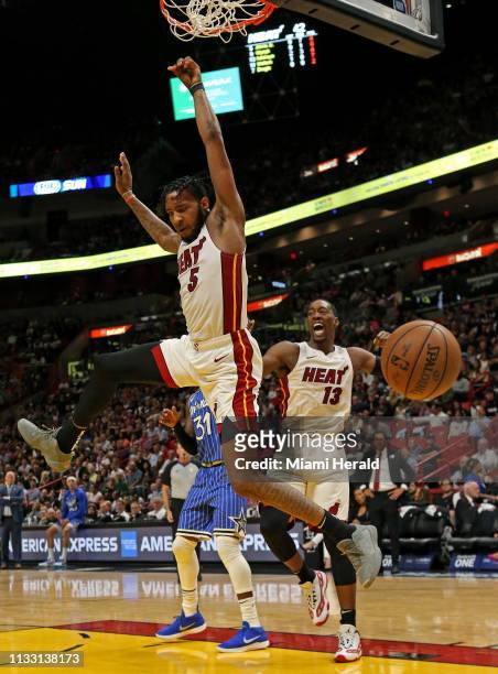 Miami Heat forward Derrick Jones Jr. Dunks against Orlando Magic center Nikola Vucevic in the second quarter of an NBA basketball game at the...
