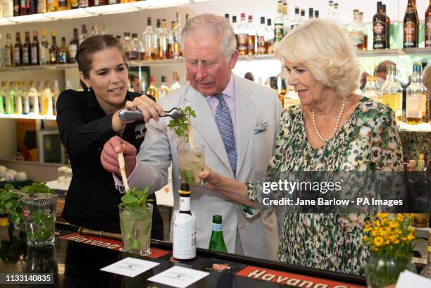 The Prince of Wales and the Duchess of Cornwall make mojito coktails during a visit to a paladar, a private restaurant, in Havana, Cuba to sample...