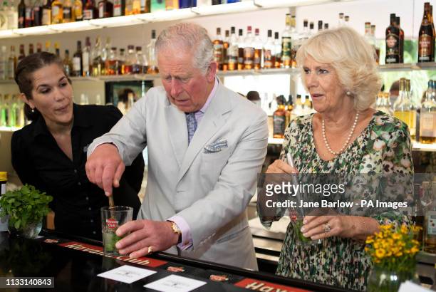 The Prince of Wales and the Duchess of Cornwall make mojito coktails during a visit to a paladar, a private restaurant, in Havana, Cuba to sample...