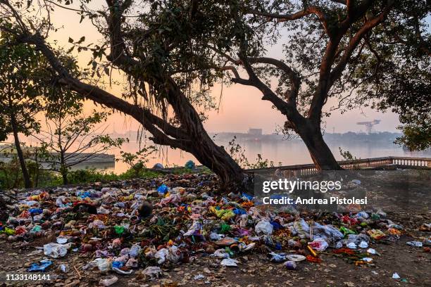 garbage dump in kolkata river port, india - india pollution stock pictures, royalty-free photos & images