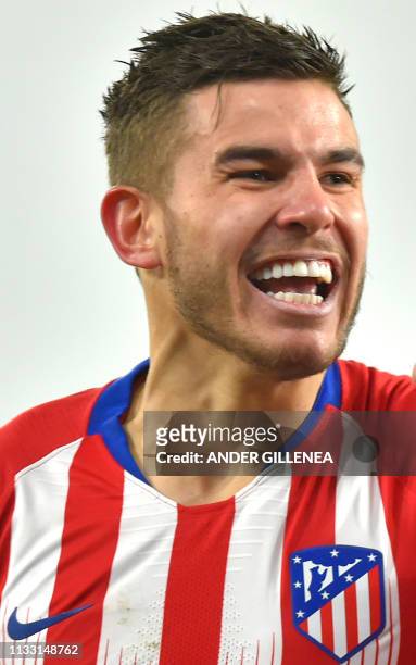 In this file photo taken on January 19, 2019 Atletico Madrid's French defender Lucas Hernandez reacts after scoring a goal during the Spanish League...