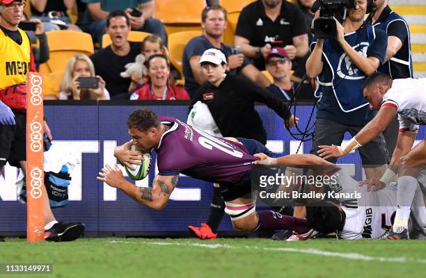Scott Higginbotham of the Reds scores a try during the round three Super Rugby match between the Reds and the Crusaders at Suncorp Stadium on March...