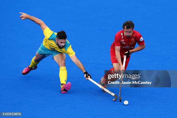 Sergi Enrique of Spain is challenged by Trent Mitton of Australia during the Men's FIH Field Hockey Pro League match between Australia and Spain at...