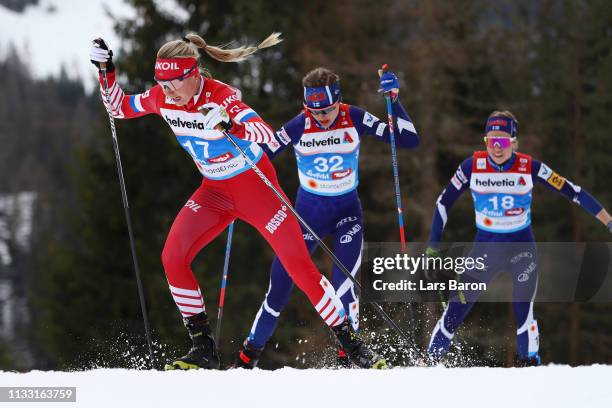 Anna Nechaevskaya of Russia, Eveliina Piippo of Finland and Laura Mononen of Finland competes in the Women's Cross Country 30k race during the FIS...