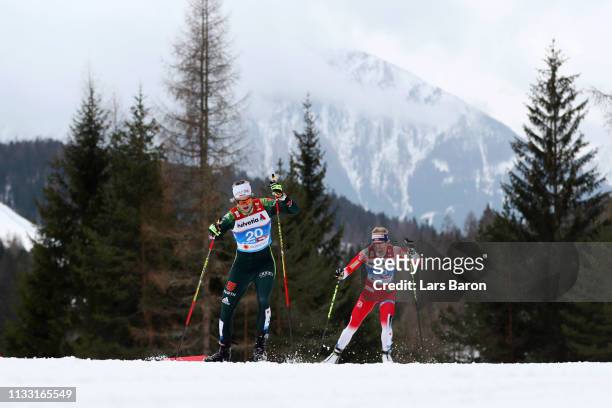 Victoria Carl of Germany and Ragnhild Haga of Norway compete in the Women's Cross Country 30k race during the FIS Nordic World Ski Championships on...