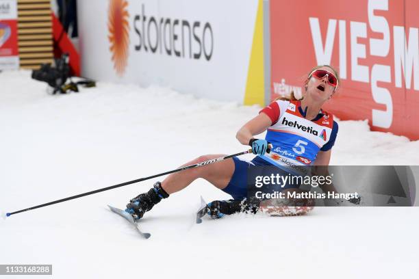 Jessica Diggins of the United States reacts as she crosses the finish line following the the Women's Cross Country 30k race during the FIS Nordic...